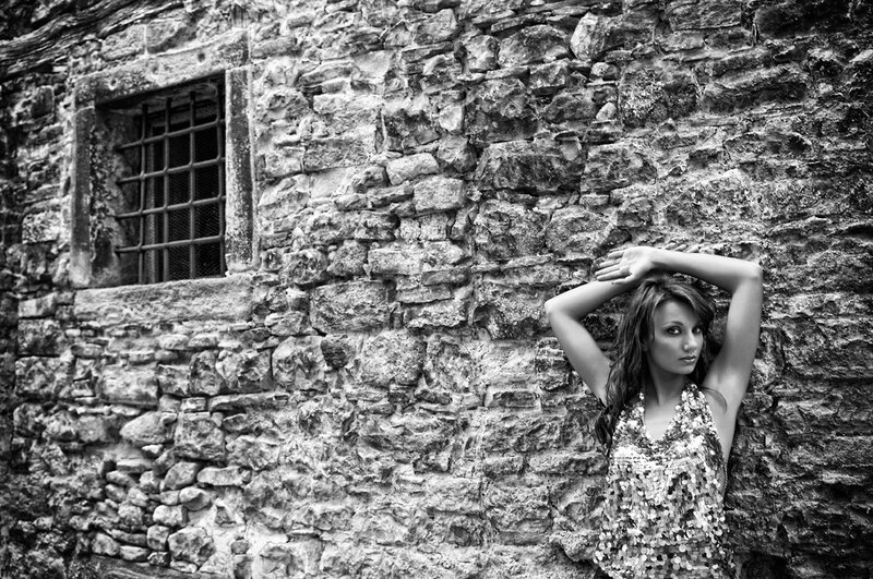 Woman in Sequined Dress — Black, Dramatic, Photograph, Stone Wall