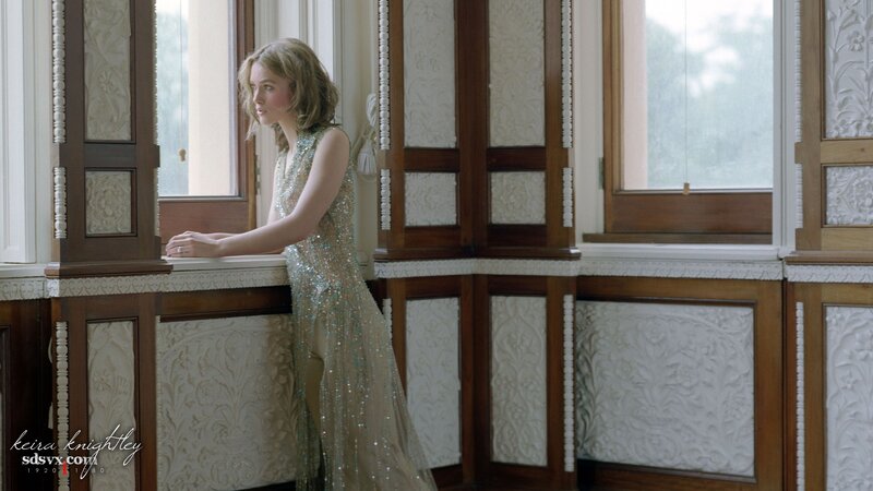 woman in sequined dress by window