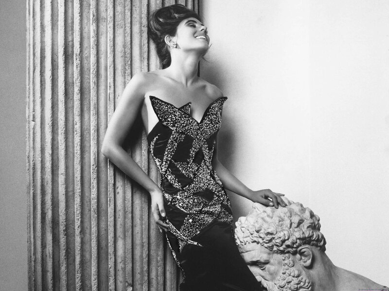 woman in sequined dress leaning