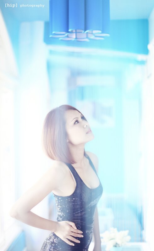 woman in sequined dress looking up