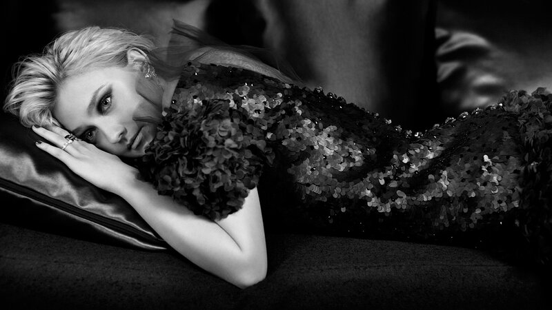woman in sequined dress lying down