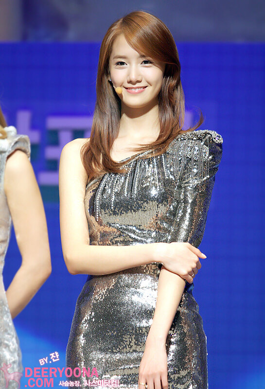 woman in sequined dress smiling