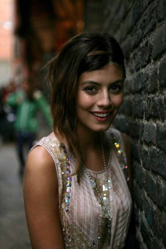 woman in sequined dress smiling