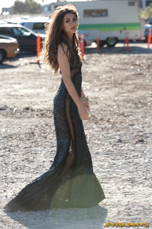 woman in sequined gown on set