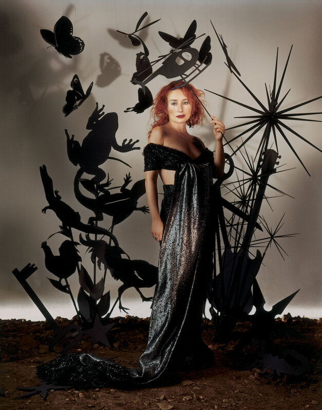 Woman in sequined gown with silhouettes