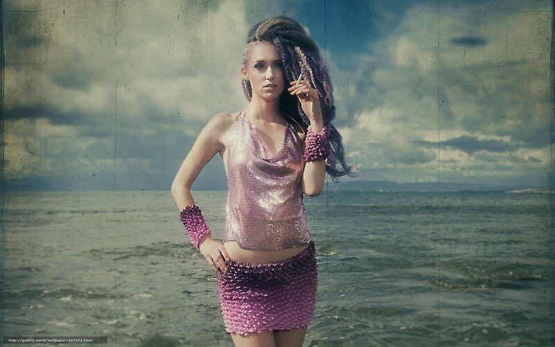 woman in sequined outfit at beach