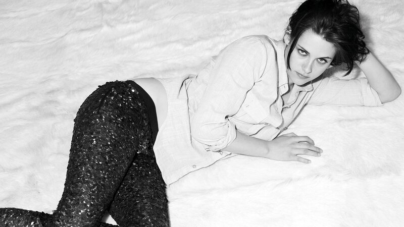 woman in sequined pants lying down