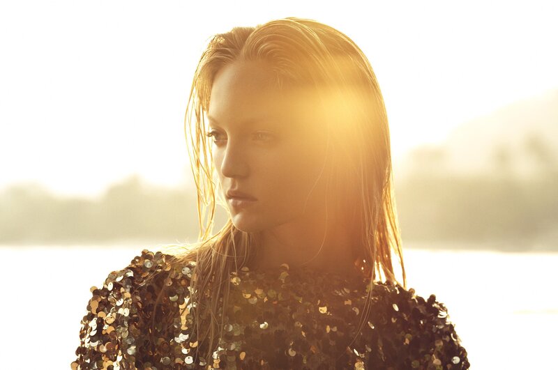 woman in sequined top at sunset