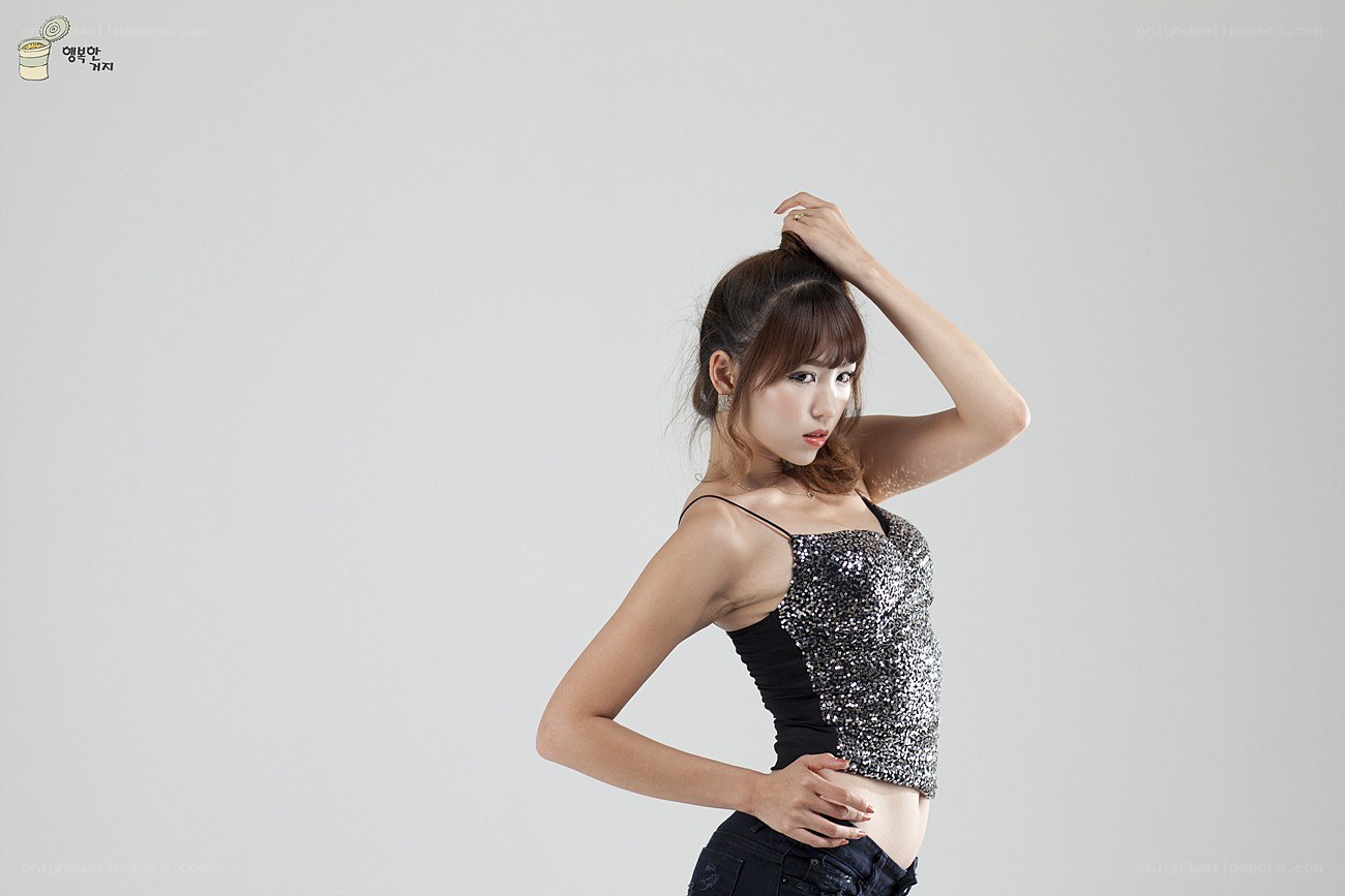 Woman in sequined top posing