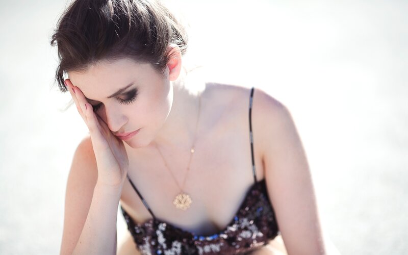 Woman in Sequined Top — White, Contemplative