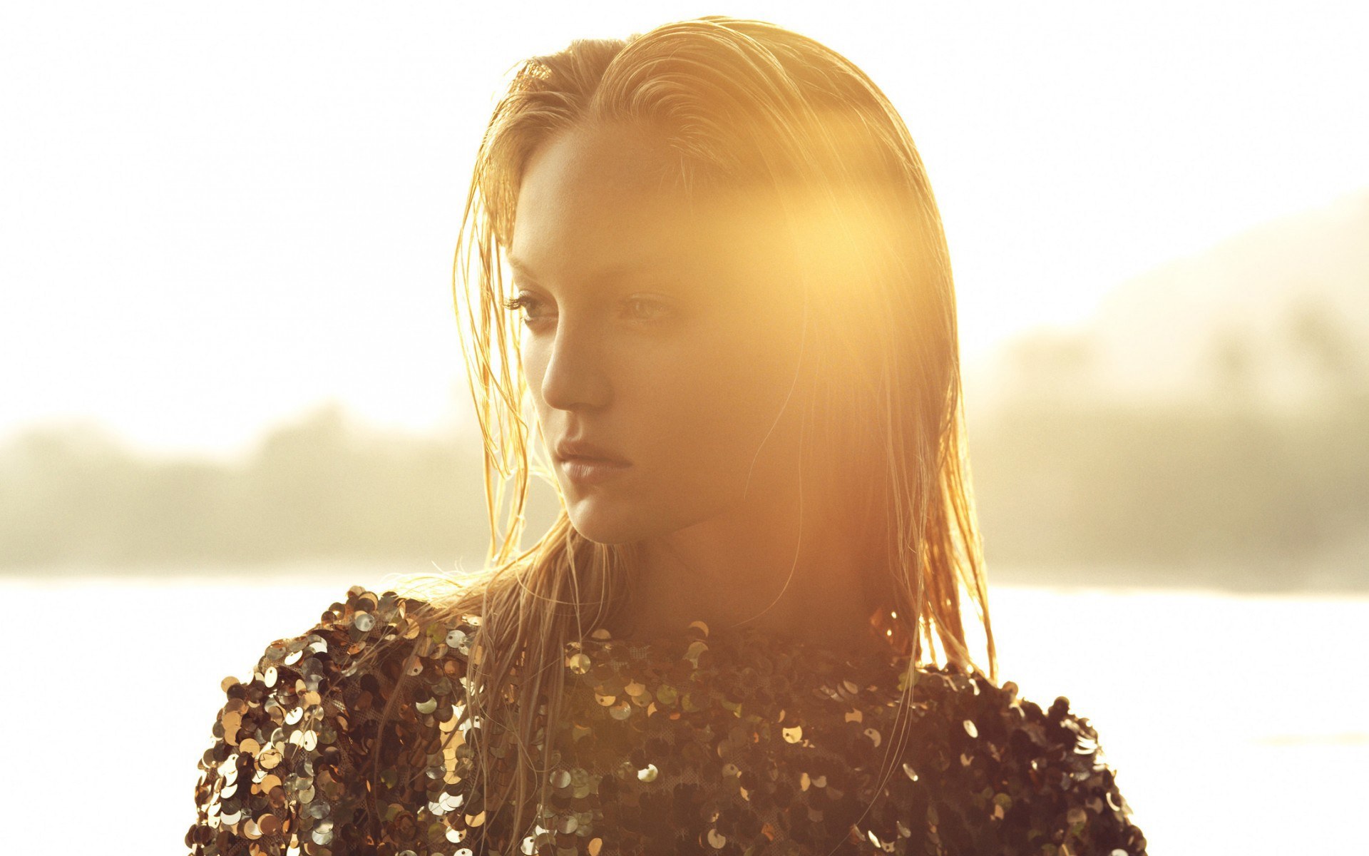woman in sequins at sunset