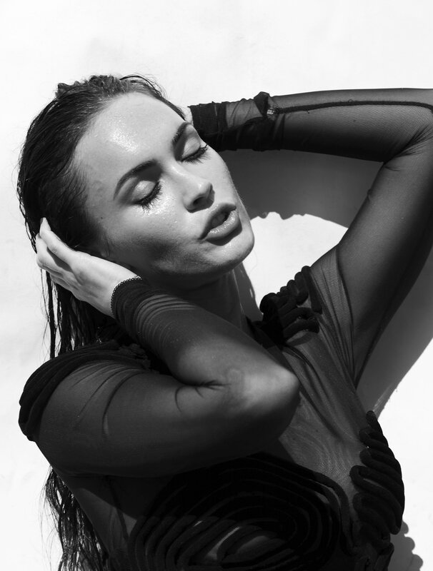 woman in sheer black top
