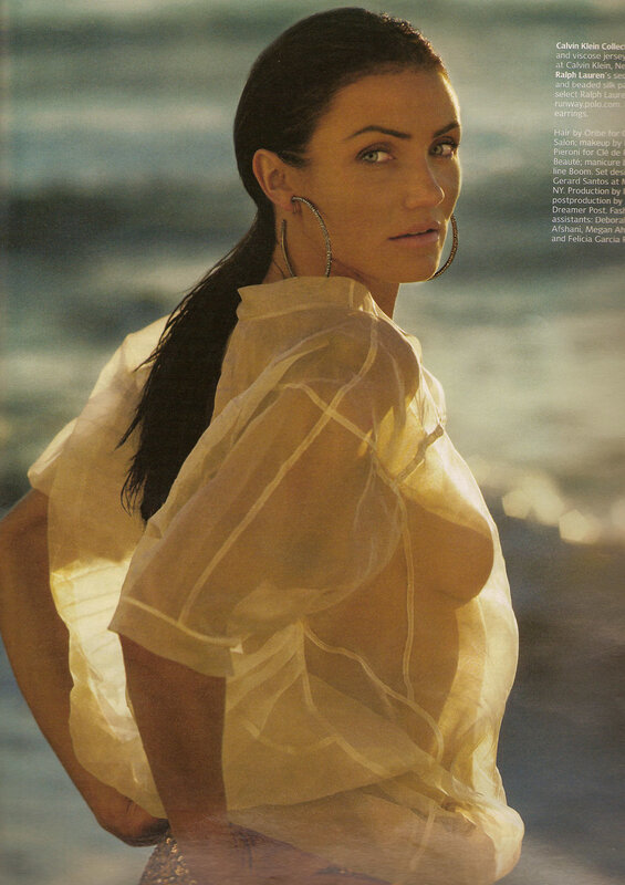woman in sheer blouse at beach