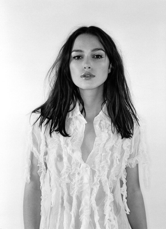 woman in sheer white blouse