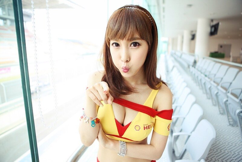 woman in shell uniform at race track