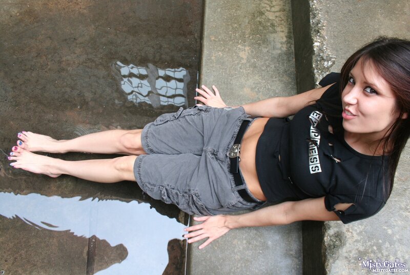 woman in shorts by water