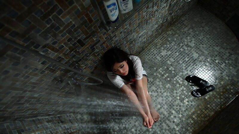woman in shower with water