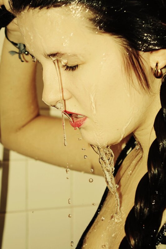 woman in shower with water