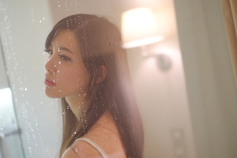 woman in shower with water droplets