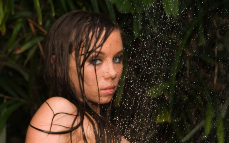 woman in shower with water droplets
