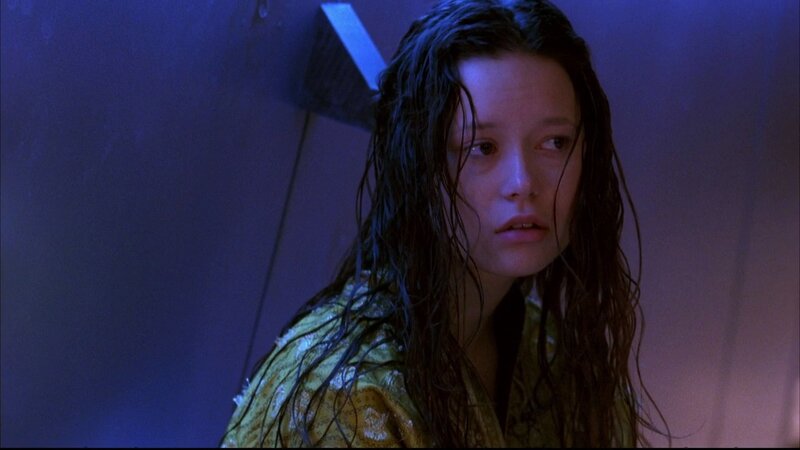 woman in shower with wet hair
