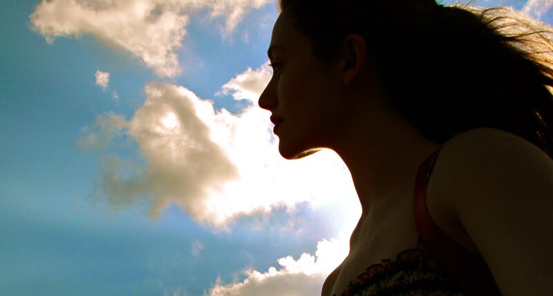 woman in silhouette against sky