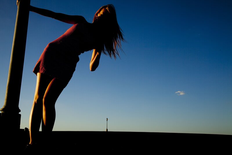 woman in silhouette at sunset