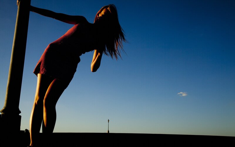 woman in silhouette at sunset
