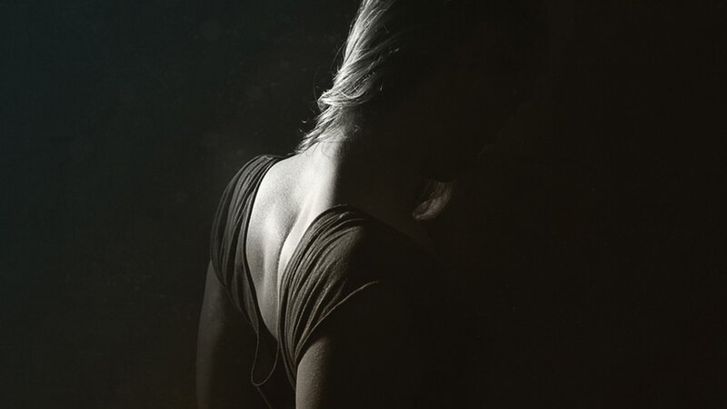 woman in silhouette from behind