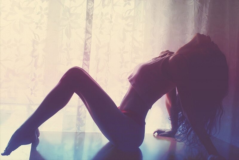 woman in silhouette on floor