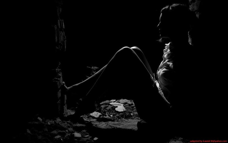 woman in silhouette on rubble