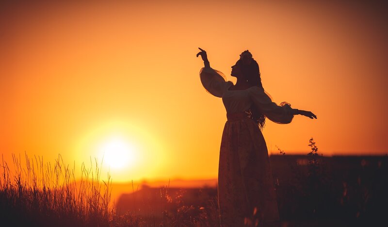 Woman in Silhouette — Orange, Dramatic, Sunset