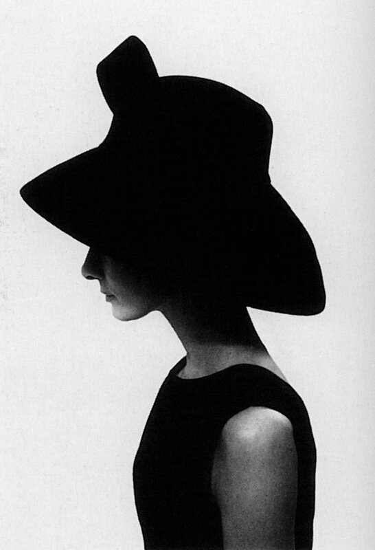 woman in silhouette with hat