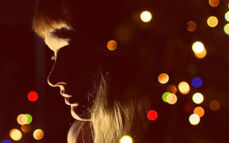 woman in silhouette with lights