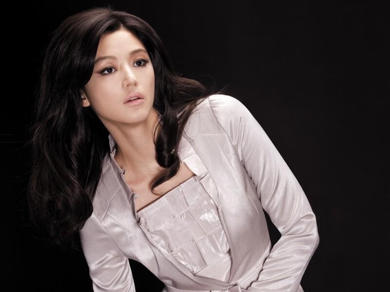 woman in silver blouse