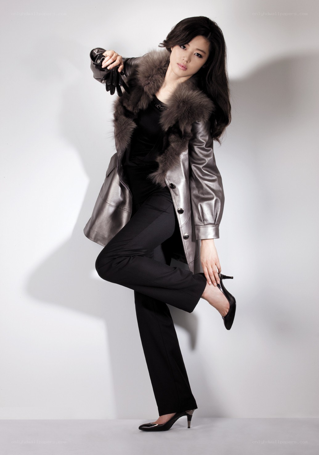 woman in silver coat posing