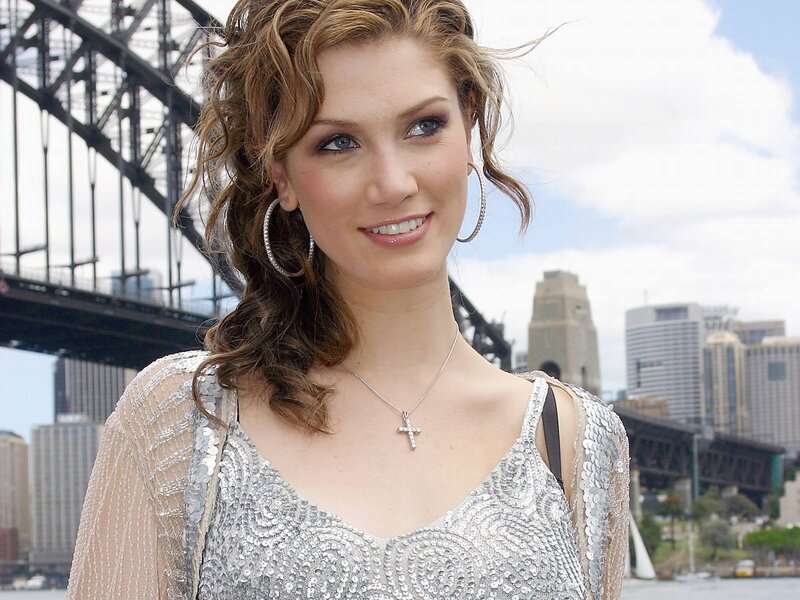 Woman in silver dress by Sydney Harbour