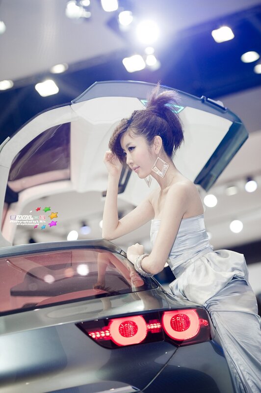 Woman in Silver Dress — Dramatic, Photograph, Car, Earrings