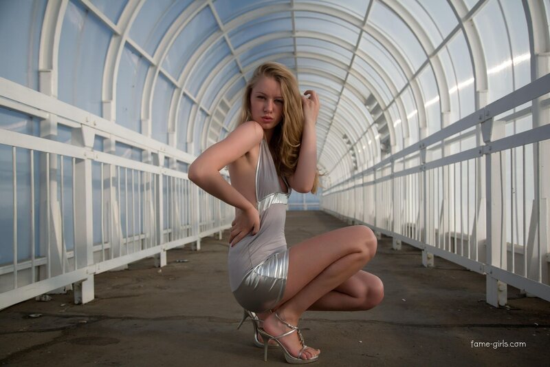 Woman in silver dress posing