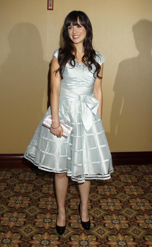Woman in silver dress smiling