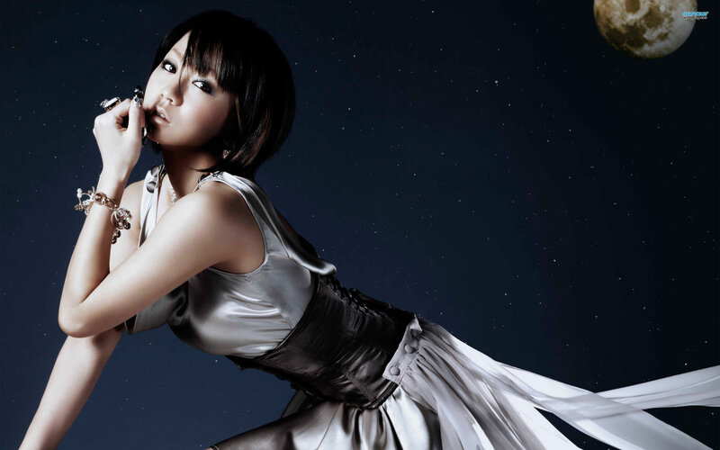 woman in silver dress under moon