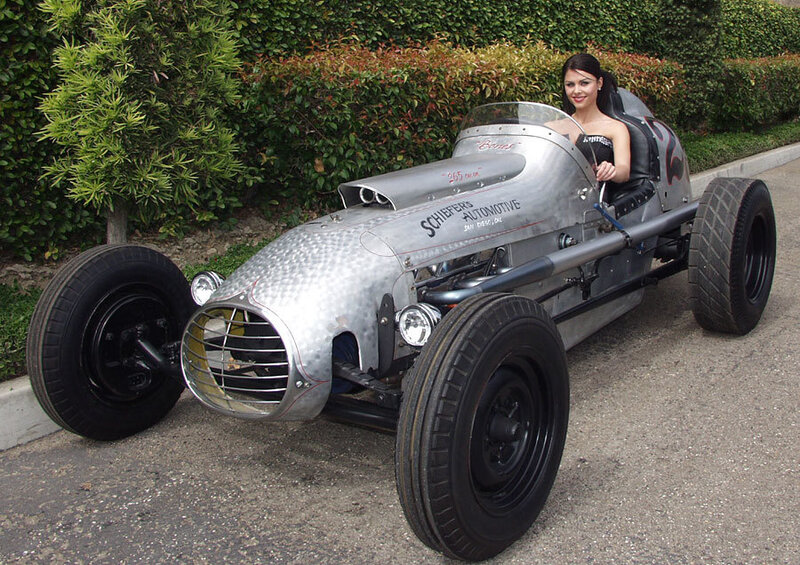 Woman in Silver Race Car