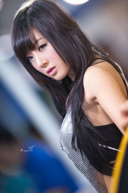 woman in silver top at event