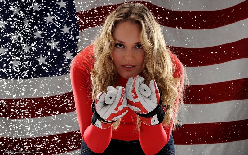 woman in ski gear with US flag