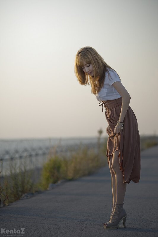 woman in skirt on a road