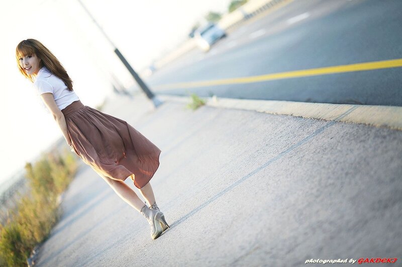 woman in skirt on roadside