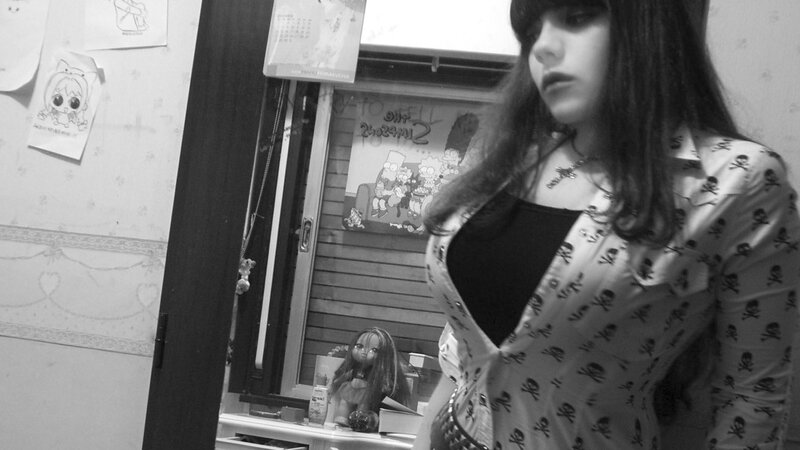 woman in skull-print shirt