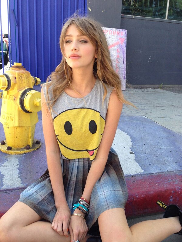 woman in smiley face shirt