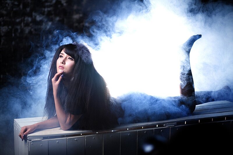 woman in smoke with fur hat