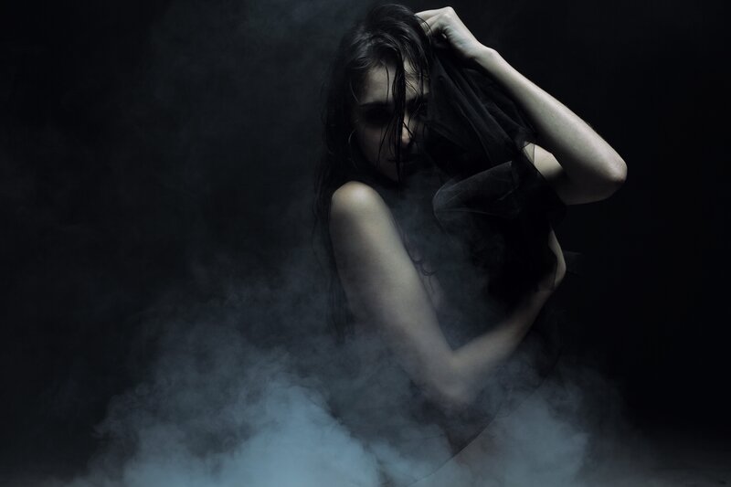 woman in smoke with veil